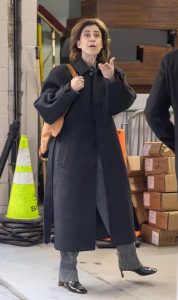 Fernanda Torres in a Black Coat