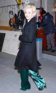 Julia Garner in a Black Coat