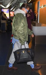 Rita Ora in an Olive Bomber Jacket