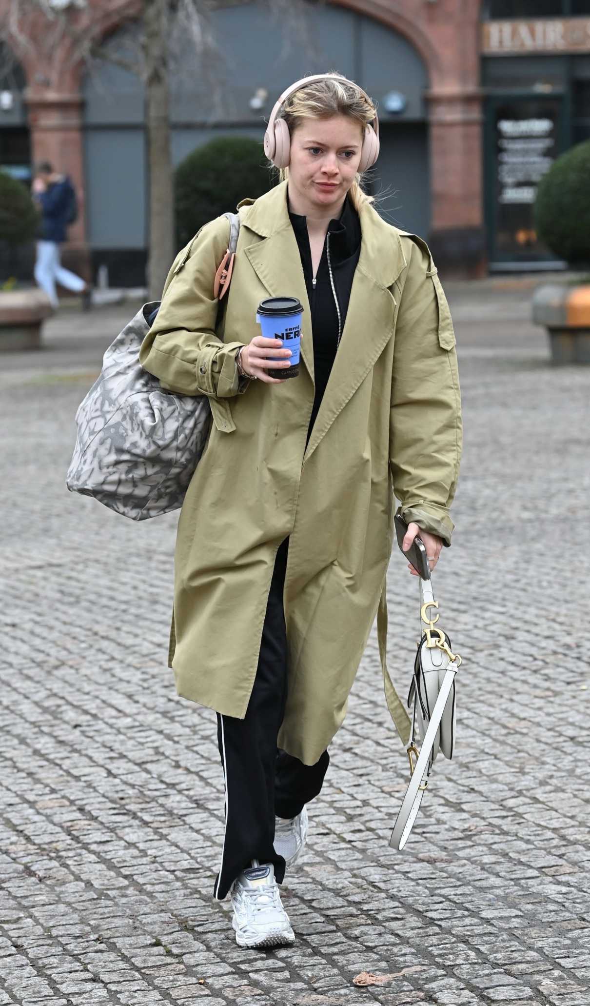 Tasha Ghouri in an Olive Trench Coat