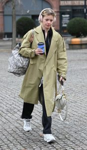 Tasha Ghouri in an Olive Trench Coat