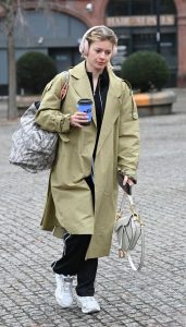 Tasha Ghouri in an Olive Trench Coat