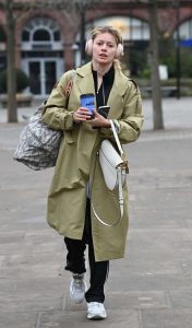 Tasha Ghouri in an Olive Trench Coat