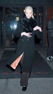 Anya Taylor-Joy in a Black Coat