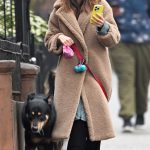 Emily Ratajkowski in a Beige Faux Fur Coat Walks Her Dog in New York City 02/13/2025