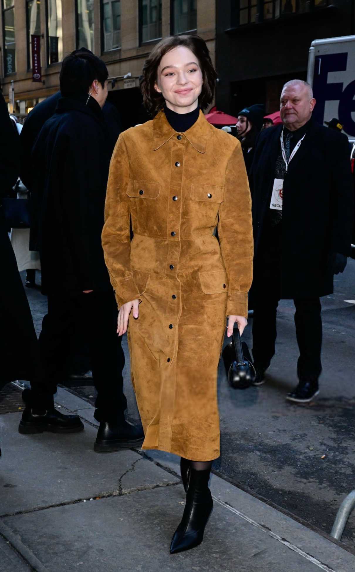 Emma Myers in an Orange Coat