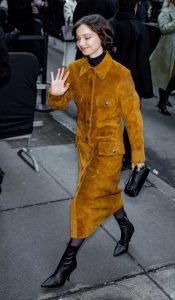 Emma Myers in an Orange Coat