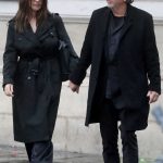 Monica Bellucci in a Black Trench Coat Was Seen Out with Tim Burton in Paris 01/26/2025