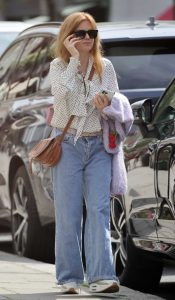 Isla Fisher in a White Polka Dot Blouse