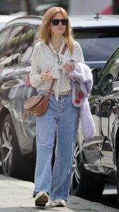 Isla Fisher in a White Polka Dot Blouse