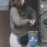 Kate Mara in a Grey Sweater Checks Tire Pressure at a Gas Station in Los Angeles 04/28/2025