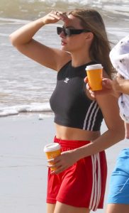 Margot Robbie in a Red Adidas Shorts