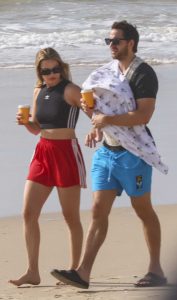 Margot Robbie in a Red Adidas Shorts