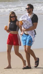 Margot Robbie in a Red Adidas Shorts