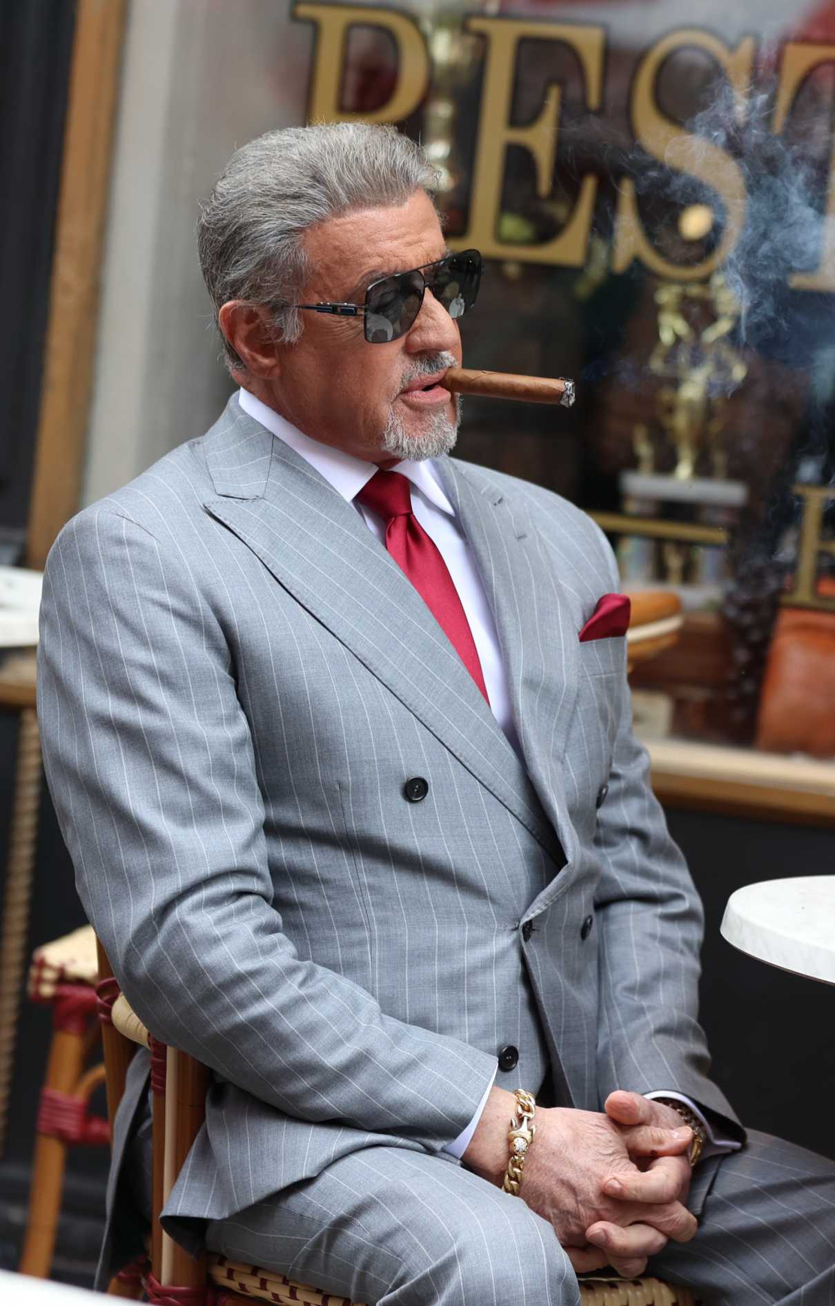 Sylvester Stallone in a Grey Pantsuit