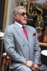 Sylvester Stallone in a Grey Pantsuit