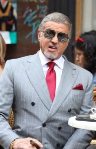 Sylvester Stallone in a Grey Pantsuit
