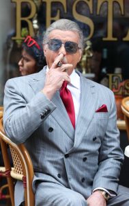 Sylvester Stallone in a Grey Pantsuit