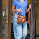 Tate McRae in a Blue Cardigan Leaves Her Hotel in Paris 05/27/2025