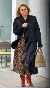 Alicia Silverstone in a Black Trench Coat