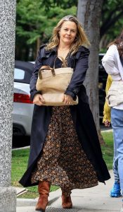 Alicia Silverstone in a Black Trench Coat