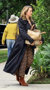 Alicia Silverstone in a Black Trench Coat