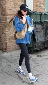 Dakota Johnson in a Black Cap