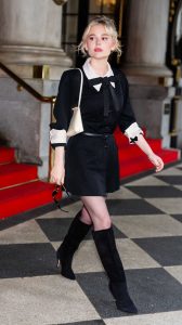 Emily Alyn Lind in a Black Dress