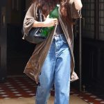 Dakota Johnson in a Blue Jeans Checking Out of Her Tribeca Hotel in New York City 07/11/2025