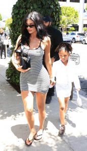 Kylie Jenner in a Plaid Form Fitting Mini Dress