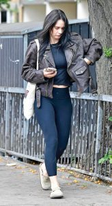 Lily James in a Brown Leather Jacket