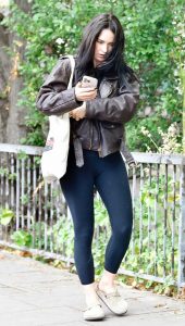 Lily James in a Brown Leather Jacket