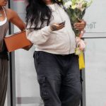 Rihanna in a Black Pants Was Spotted Touching Down with a Large Bouquet of Flowers in Los Angeles 07/12/2025