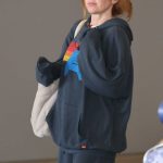 Isla Fisher in a Navy Sweatsuit Arrives at LAX Airport in Los Angeles 08/03/2025