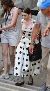 Lily Collins in a White Polka Dot Ensemble