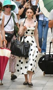 Lily Collins in a White Polka Dot Ensemble