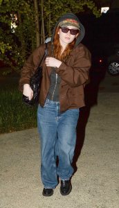 Sadie Sink in a Black Hoodie