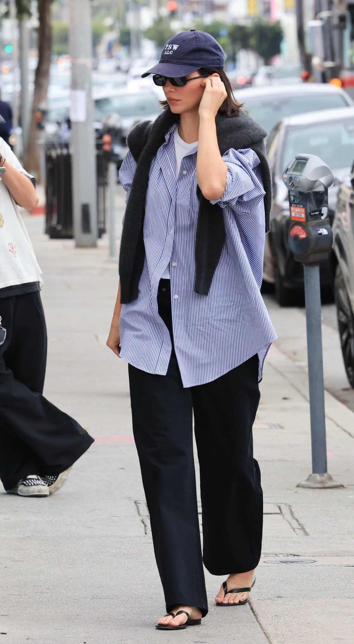 Kendall Jenner in a Black Flip-Flops