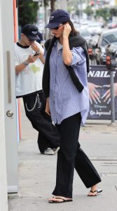 Kendall Jenner in a Black Flip-Flops