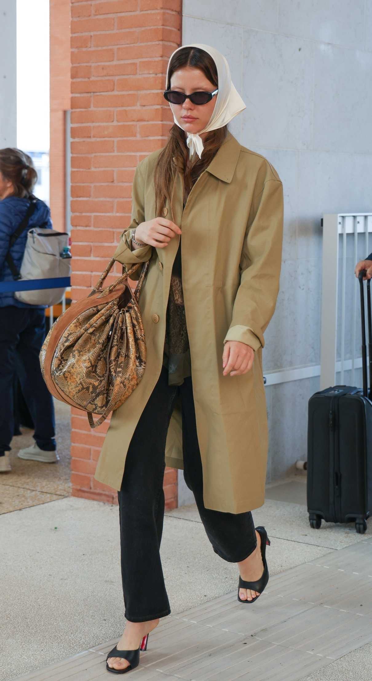 Mia Goth in a Beige Trench Coat