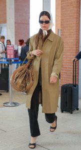 Mia Goth in a Beige Trench Coat