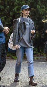 Lily Collins in a Black Leather Jacket