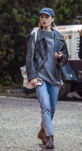 Lily Collins in a Black Leather Jacket