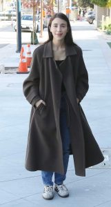Caylee Cowan in a Brown Coat