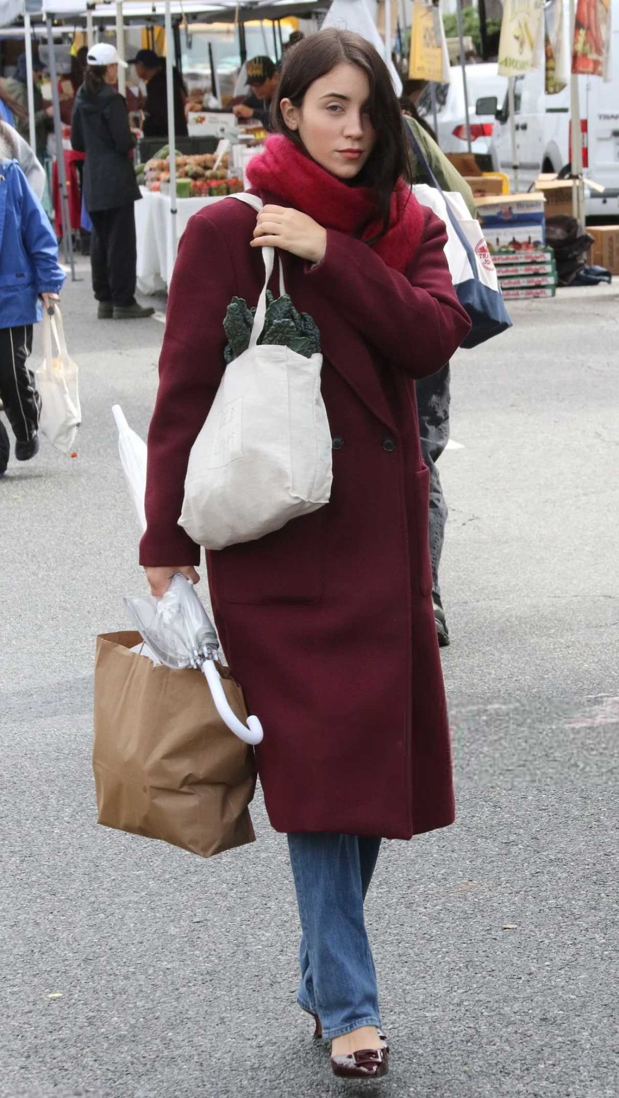 Caylee Cowan in a Burgundy Coat
