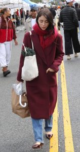 Caylee Cowan in a Burgundy Coat