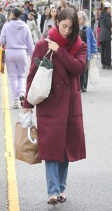 Caylee Cowan in a Burgundy Coat