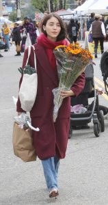 Caylee Cowan in a Burgundy Coat