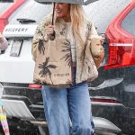Hilary Duff in a Blue Jeans Grabs an Iced Coffee on a Rainy Day in Los Angeles 11/20/2025