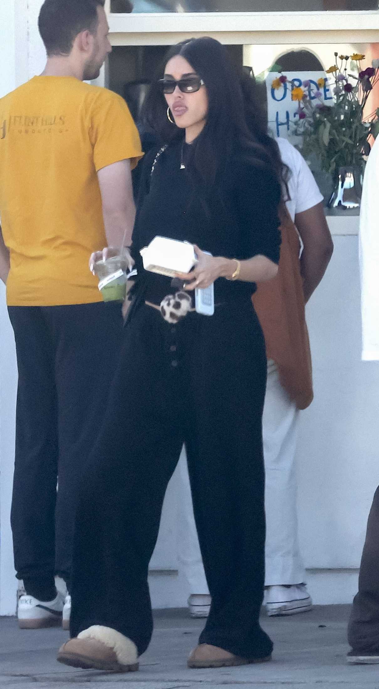 Madison Beer in a Black Sweatsuit